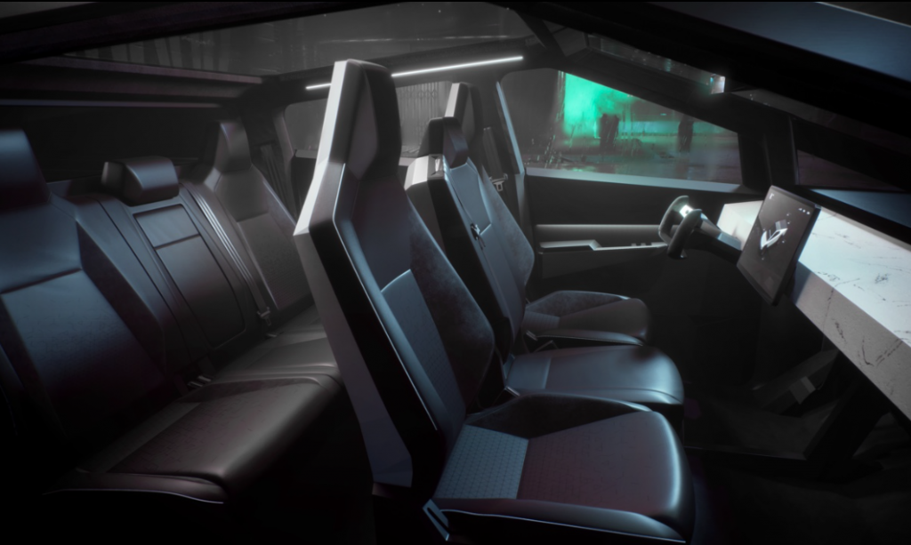 Tesla: Inovação, design, tecnologia e beleza, beleza? 4 inovação. a foto mostra a parte interna do carro com bancos em couro preto e detalhes de acabamento em linhas retas.